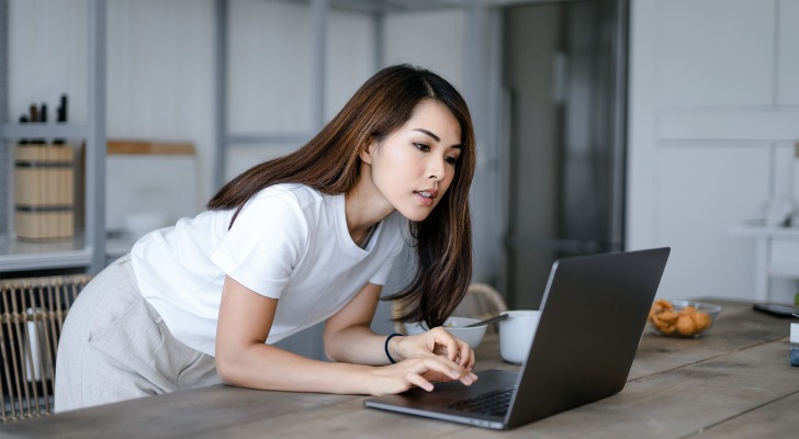 A woman checking her 401(k) for socially responsible investing