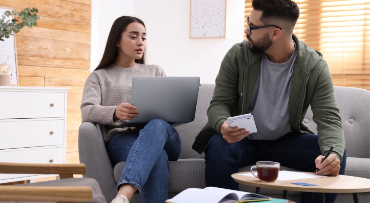A couple discussing an adjustable life insurance policy