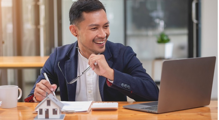 An RIA discussing real estate investments with a client in a video meeting.