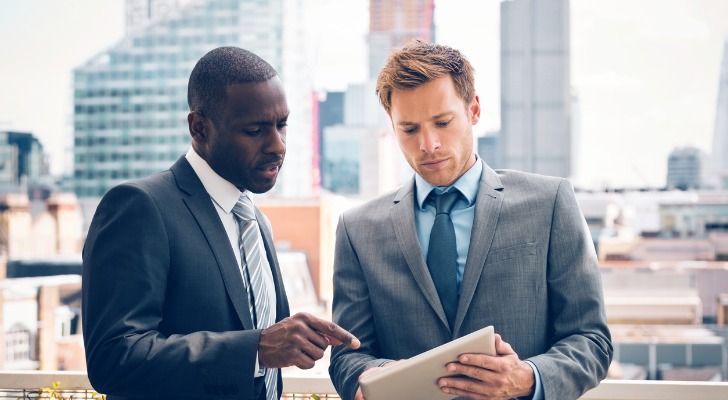 A pair of investors who are part of a real estate limited partnership (RELP) discuss a project