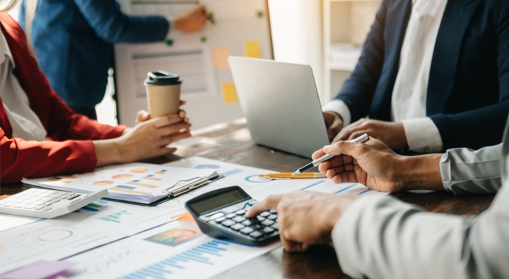 Mutual fund advisors reviewing portfolio strategies.