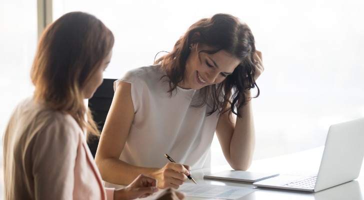 Two advisors working on the transition of a financial advisor firm.