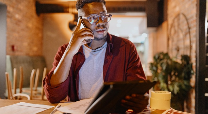 A man calling a broker to get more information about setting up a Solo 401(k).