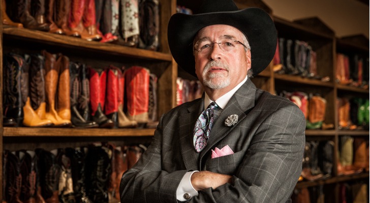 A senior businessman thinking about the differences between a living trust and a will in Texas.