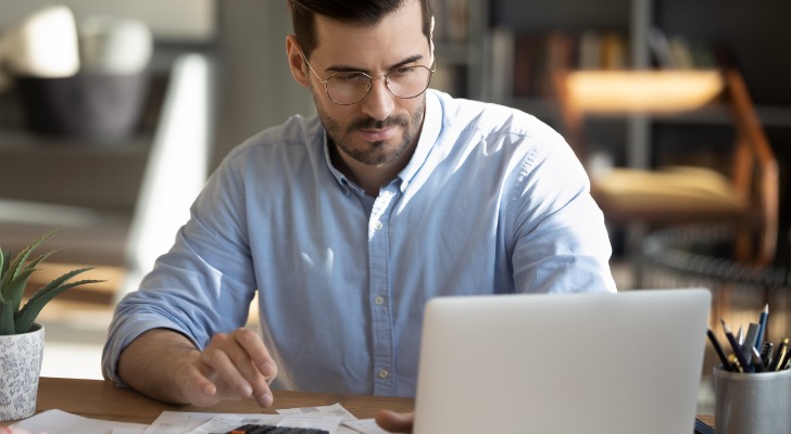 An investor researches a company before investing in dividends.