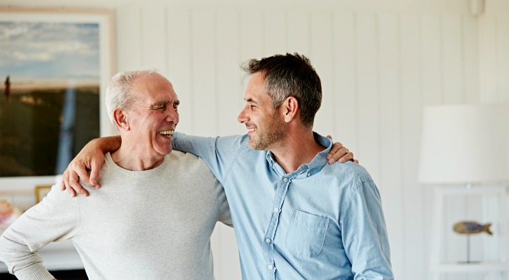A father and son share a happy moment while embracing