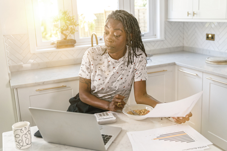 A woman plotting financial milestones for her retirement plan.