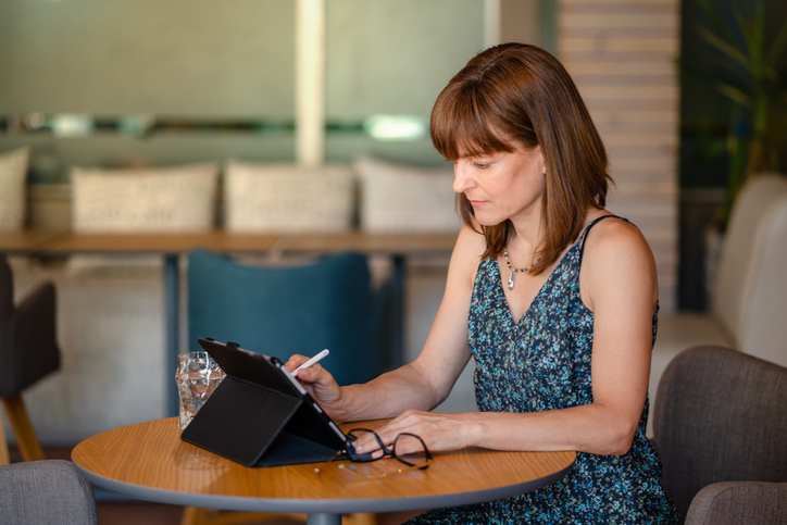 A woman strategizing to increase her net worth after looking at the average for her age group.