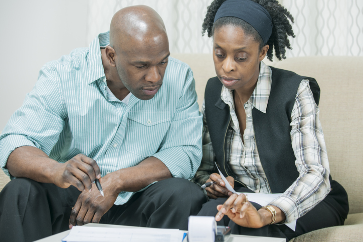 A couple working on changing the money scripts that affect their finances.