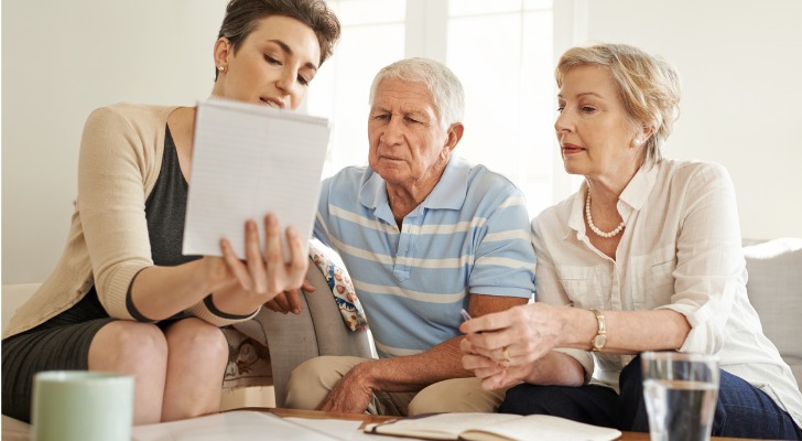 A financial advisor reviewing peer-to-peer lending terms with clients.