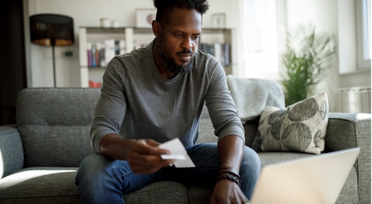 A man researching how unearned income or passive income gets taxed.