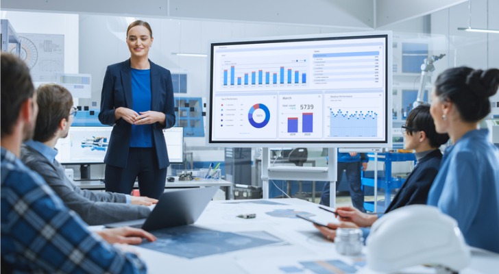 A team going over financial advisor industry statistics.