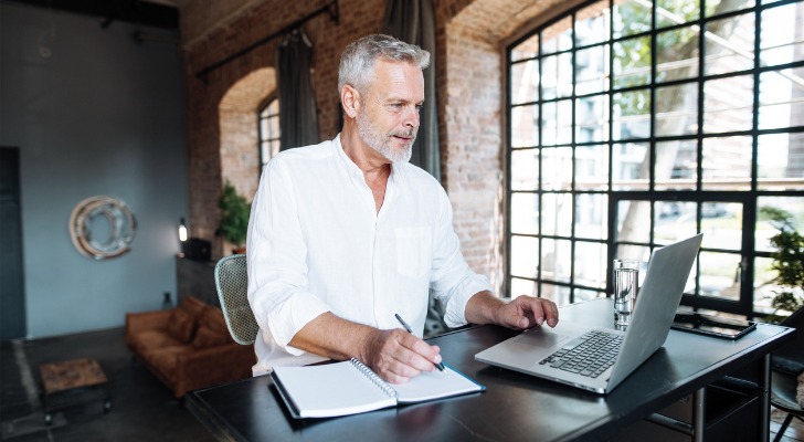 A man researches his options before taking out a variable annuity.
