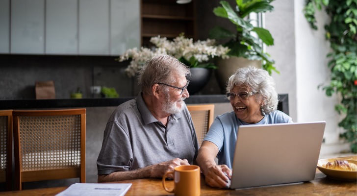 A retired couple goes over their monthly budget together.
