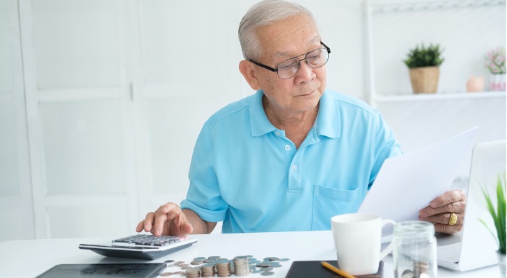 A retiree looks over his IRA balances and calculates his RMDs.