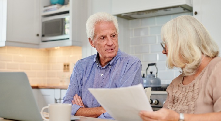 A senior couple discussing the benefits of portability to get estate tax exemptions.