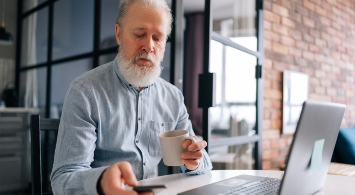 A man researching the risks of a variable annuity.