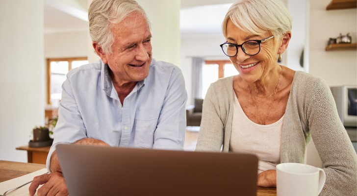 A senior couple reviewing their Social Security benefits after reaching full retirement age.