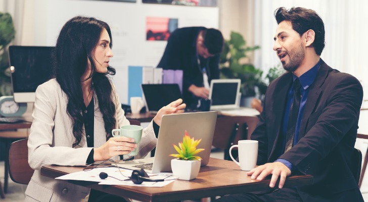 Financial advisors discussing SEC compliance