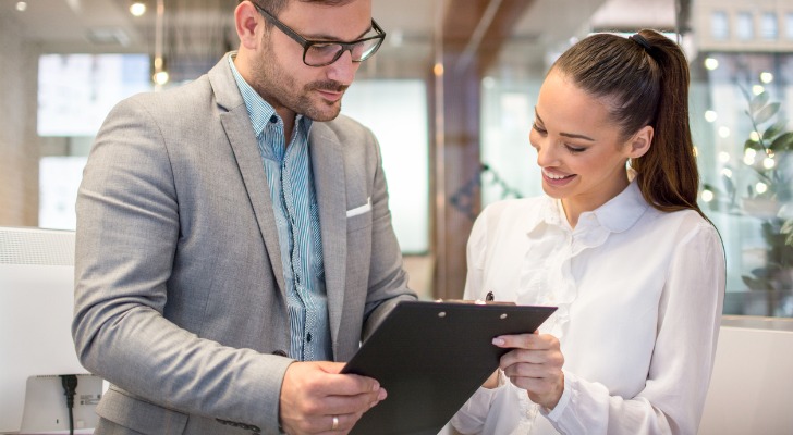 A financial advisor reviewing a list of tax-advantaged investments with a client.