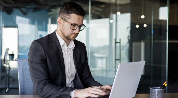 A financial advisor works on his digital marketing strategy.