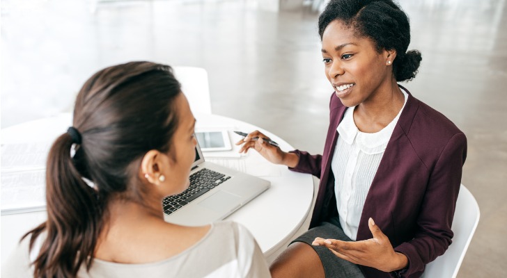 An RIA compliance consultant speaks with a financial advisor about some of the services she can offer the firm.