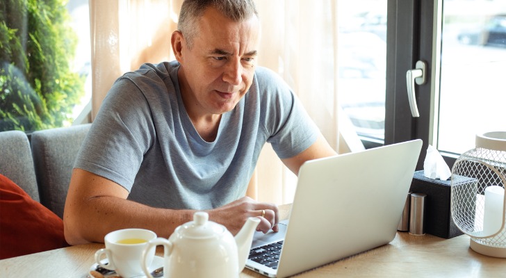 A self-employed worker tracking the progress of his solo 401(k).