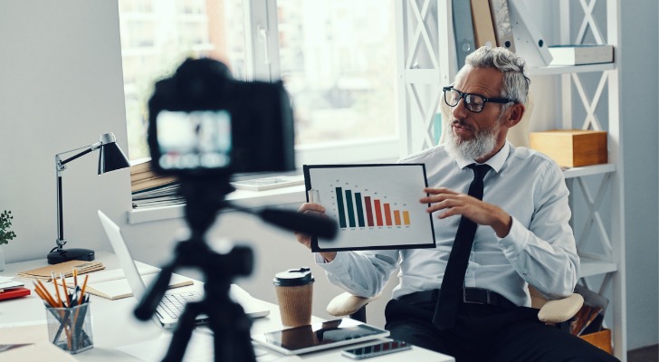 A financial advisor demonstrating his expertise through video marketing.