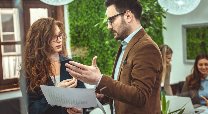 Two financial advisors review their strategy for reaching out to a target market.