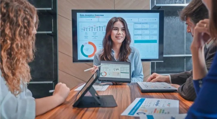 Financial advisors reviewing their video marketing strategy to engage both clients and prospects.