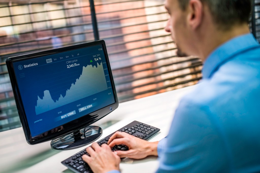 A financial advisor using portfolio rebalancing software.