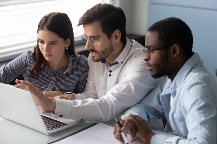 Financial advisors teaming up to work on their elevator pitches for clients.