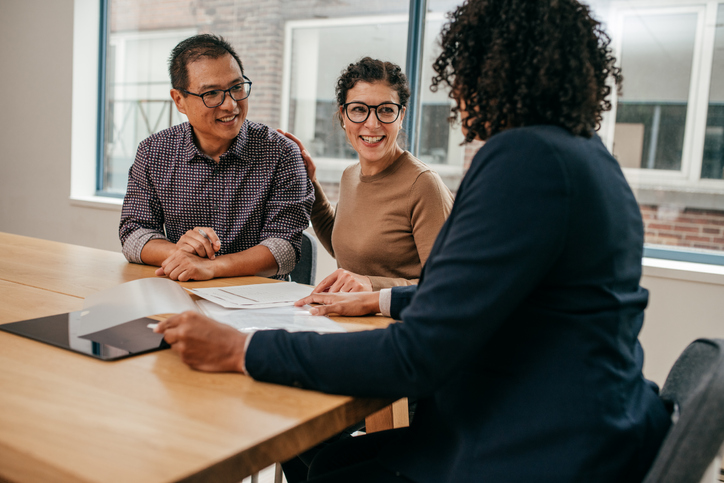 Clients meeting with an independent financial advisor to review different options for their financial plan.
