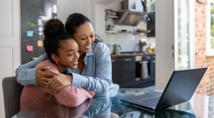 A mom and daughter review their college savings plan.