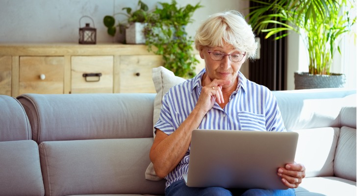 A senior looking up the tax requirements for a Roth IRA.