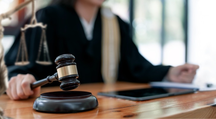 A judge uses her gavel to start a spousal property petition hearing.