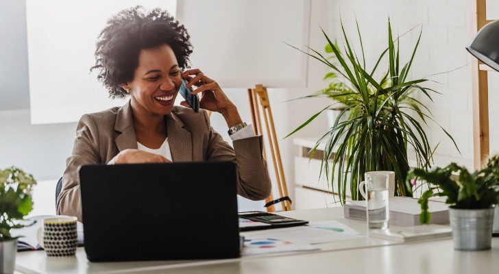A financial advisor discussing Rule 72(t) with a client on the phone.