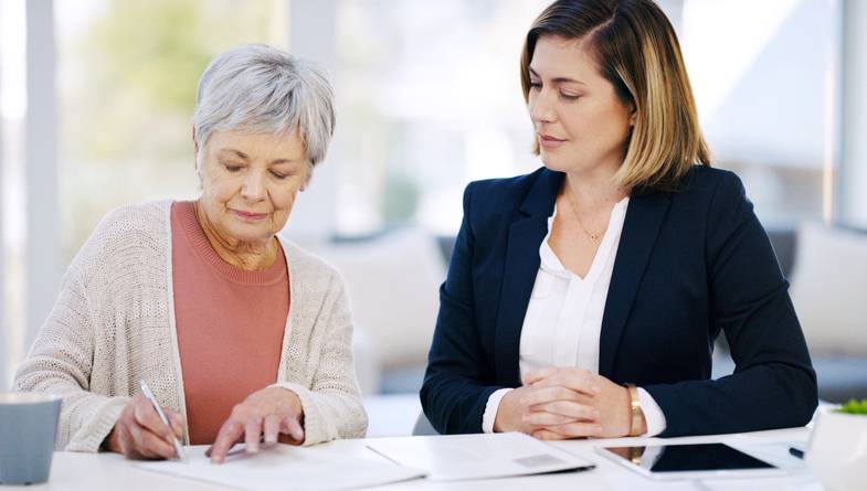 A CFP working with a senior client to reach different financial planning goals.