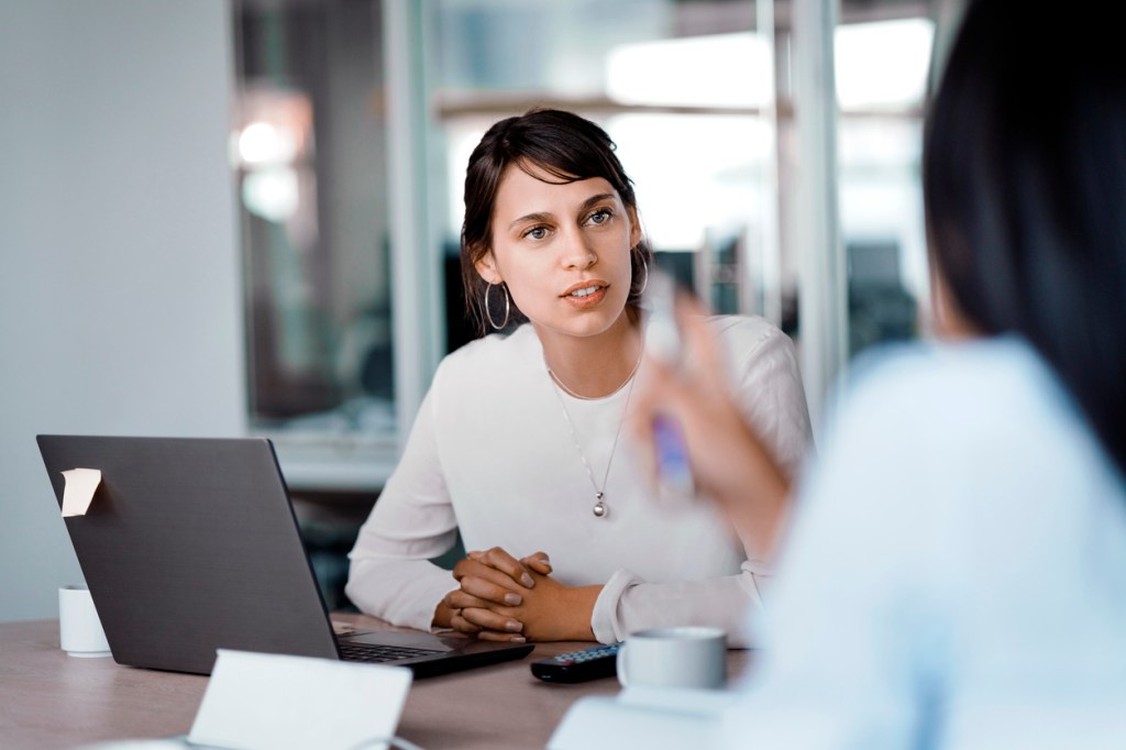 A financial advisor discussing a marketing strategy with her colleague.
