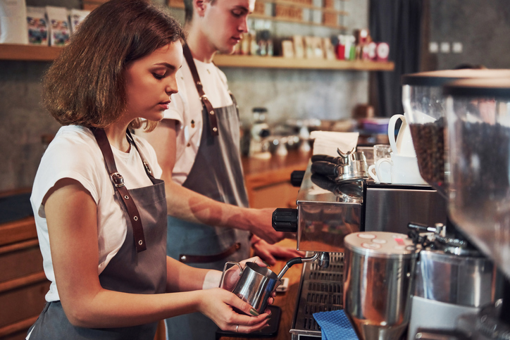 A teenager employed at the family coffeeshop.