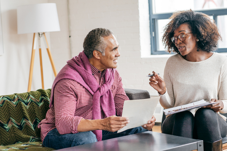 A senior meets with a financial advisor to discuss revoking a power of attorney.