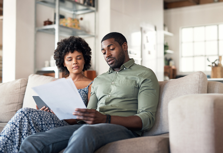 A couple considering the differences between joint and separate tax filings.