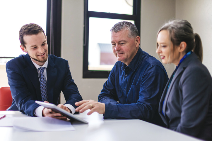 A financial advisor working with new clients after using a marketing strategy that focuses on annuity leads.