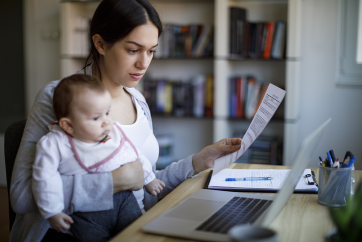 Mother researching how much of a tax refund she could get with the additional child tax credit (ACTC).