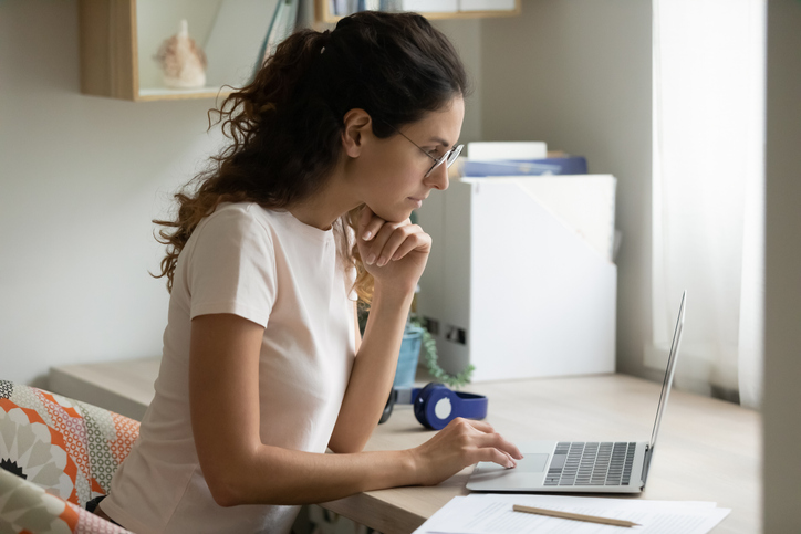 A woman registering for the Series 65 exam.