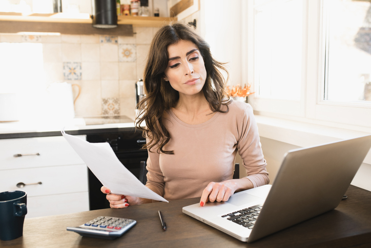 A woman researching current legislation on private mortgage insurance premium deductions.