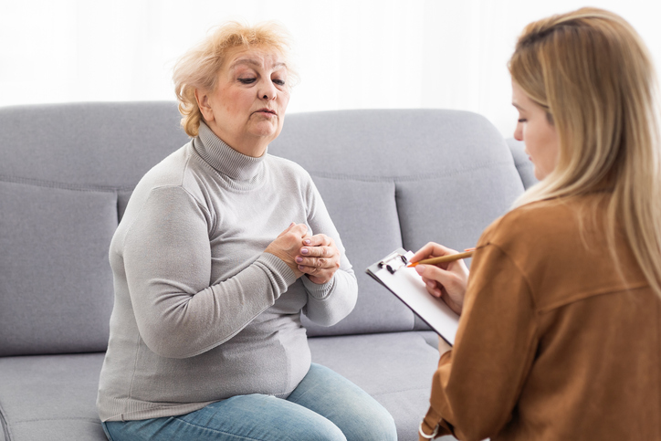 A senior consulting a financial advisor about the benefits and drawbacks of annuities.