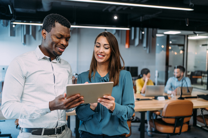 Two financial advisors discussing how they could use lead generation services to market their firm.