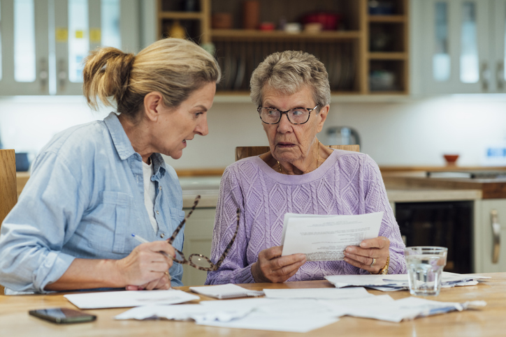 A mother and daughter comparing how much their family would pay in inheritance taxes without estate planning in Oregon.