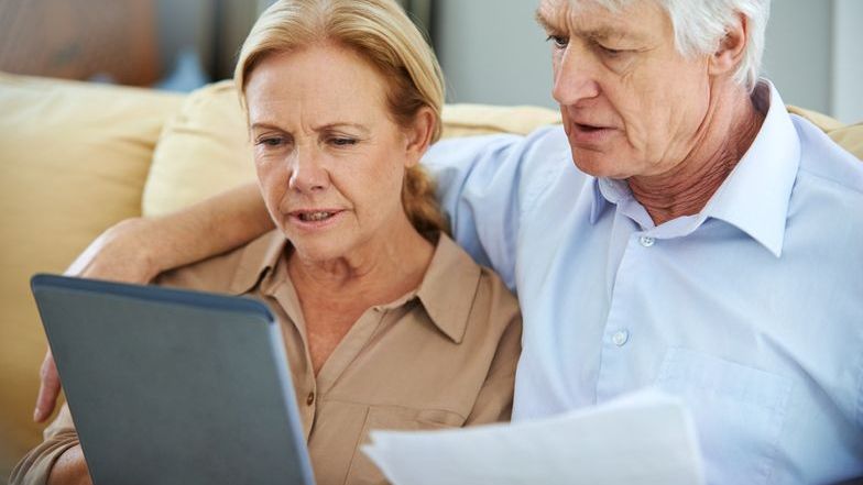 A retired coupled considers converting their retirement savings into a Roth IRA.